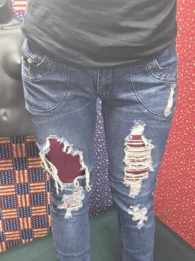 **Women’s Skinny Distressed Blue Jeans with Burgundy Patch Details**